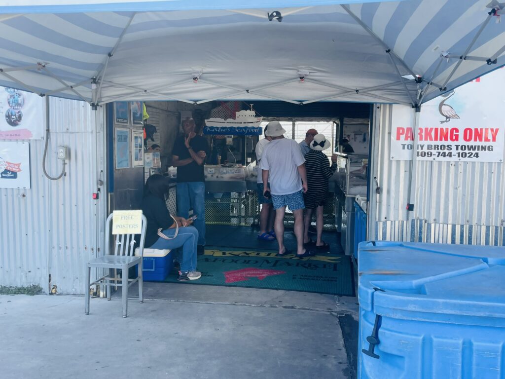 Customers buying seafood at Pier 19 in Galveston